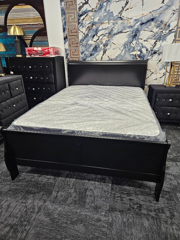 New black queen bed frame with mattress and boxspring