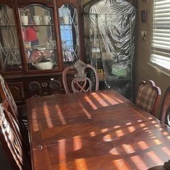Antique 6 Chair Dinning Set With China cabinet Asking $300 Table is 5.5 feet and with leaf  + 19 inches 42 inches wide Cabinet is 78 inches high by 49