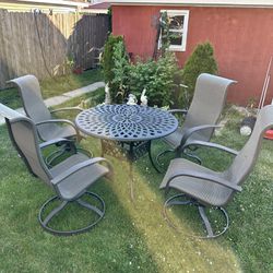 Patio Table And 4 Swivel Chairs