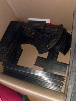 Whole box of race car tracks / Train tracks