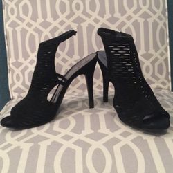 Material girl sandal style open toe booties in black suede like material with buckles at the ankle. Size 9. Good condition. This is marked as