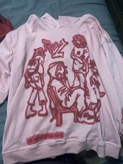 Pink hoodie with graphics on it.