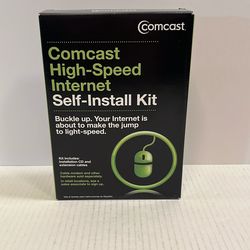 The image shows a Comcast High-Speed Internet Self-Install Kit, which is a vintage or collectible item.  It
