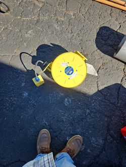 Ericson brand power cord reel.
The product is a commercial-grade or industrial-grade cable reel.