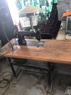 Antique Singer Upholstery Machine. Has been converted to electric. All parts for treadle still there. Works like a dream.