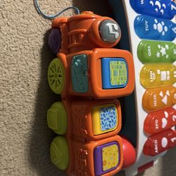 Fisher price giant stacking toy, interactive train,wooden bead maze, etc…..