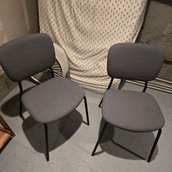 two small lightweight Ikea chairs