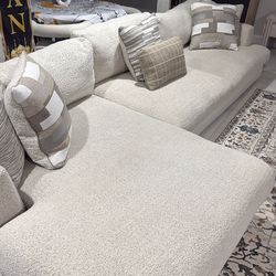 Couch from rooms to go greige , about 12ft by 5 foot VERY COMFORTABLE