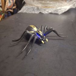 Play Right Electronic Spider W/Bright Blue & Red LED'S, Gold Stripe & Crawling Action Incl: 3 Button Cell Batteries 6.5" X 4.5"