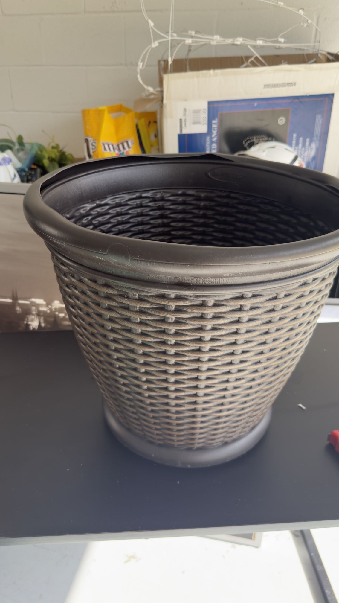 Selling a large brown plant pot.