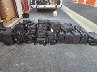 Compact travel bag with smart organization, lightweight design 100 pcs. $800 obo for lot.