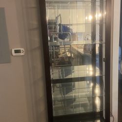 Brown Glass Curio Cabinet With 7 Glass Shelves.  Side Panel Missing On One Side. 100 OBO