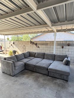 HUGE GREY SECTIONAL COUCH/ BED ***FREE DELIVERY ***
