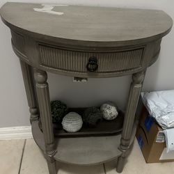 Gray Small Table With Stain On Top 