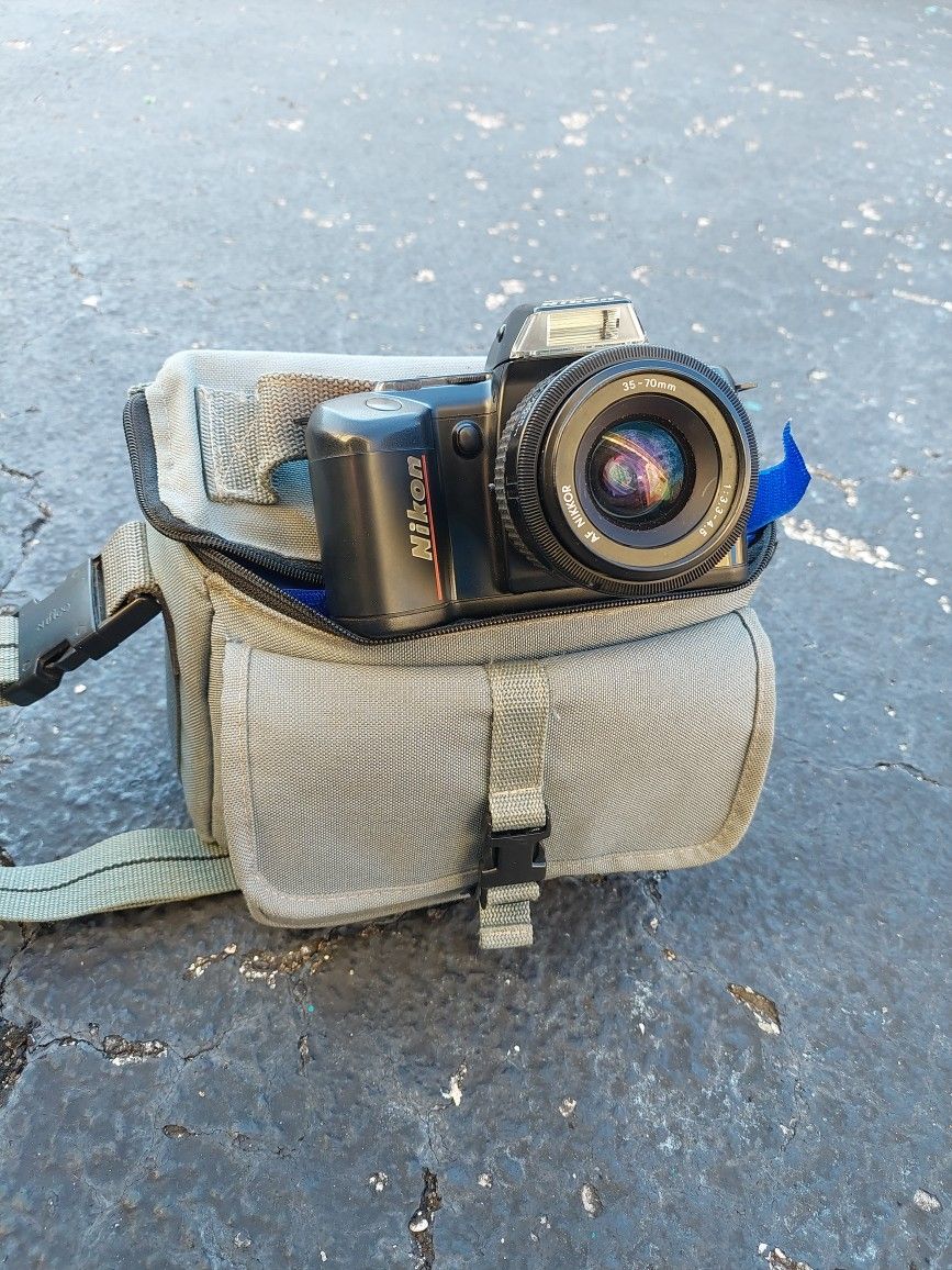 Nikon Camera With Added Lens Attachment, And Case