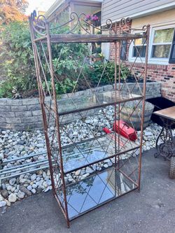 Beautiful metal folding bakers rack with glass shelves
