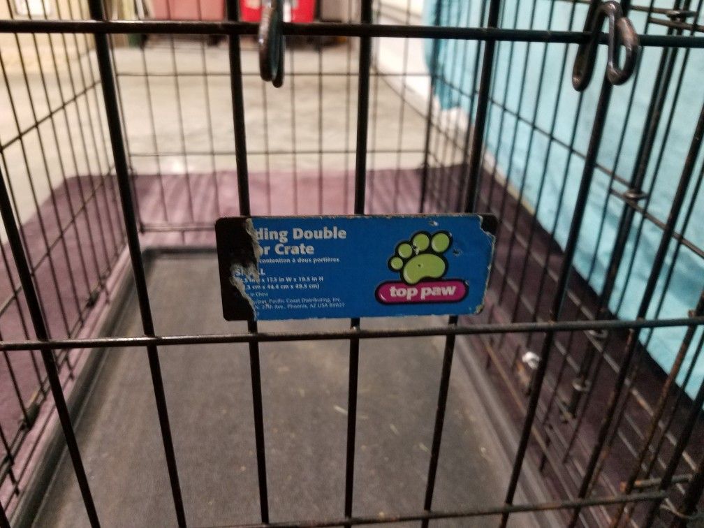 Med sized dog cage with liner.