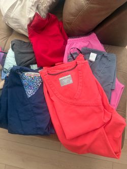 4 pairs of small scrubs