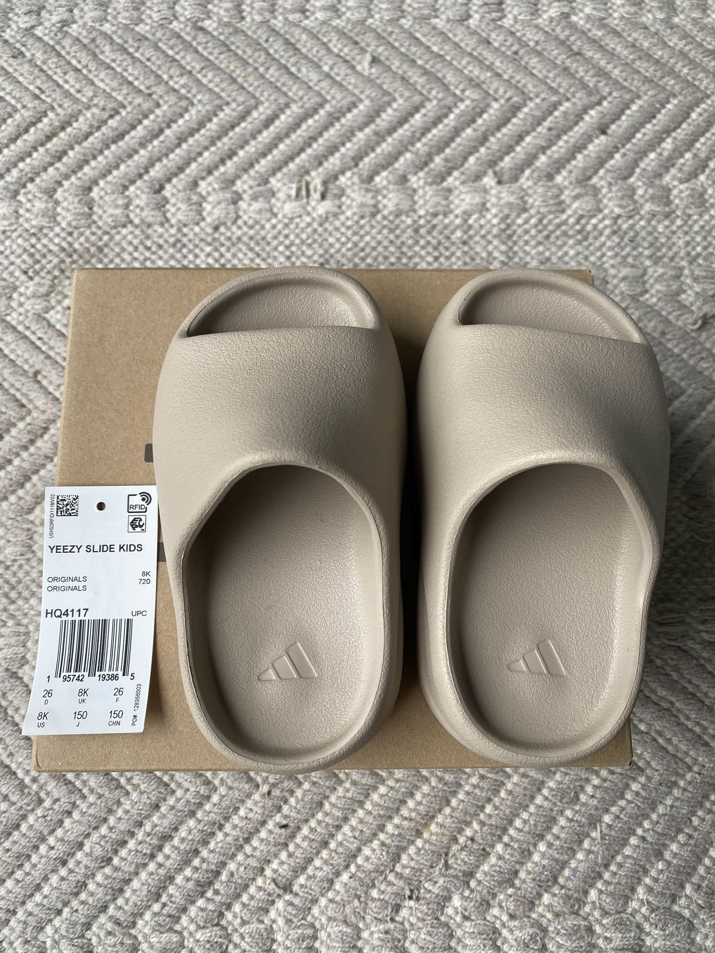 Yeezy Slides In Color Pure