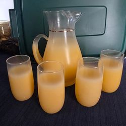 Blending 1950’s This is the blendo glass pitcher with 4 matching glasses, orange, 1950's