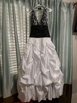 Size 7/8 halter top . Black and white ruffle dress . White shawl included