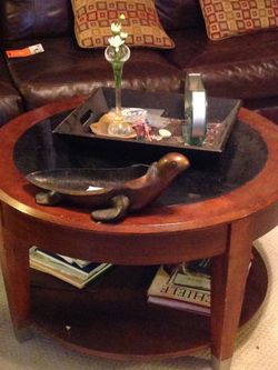 Round wood and granite 2 tiered coffee table, on casters