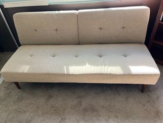 One futon couch and two arm chairs