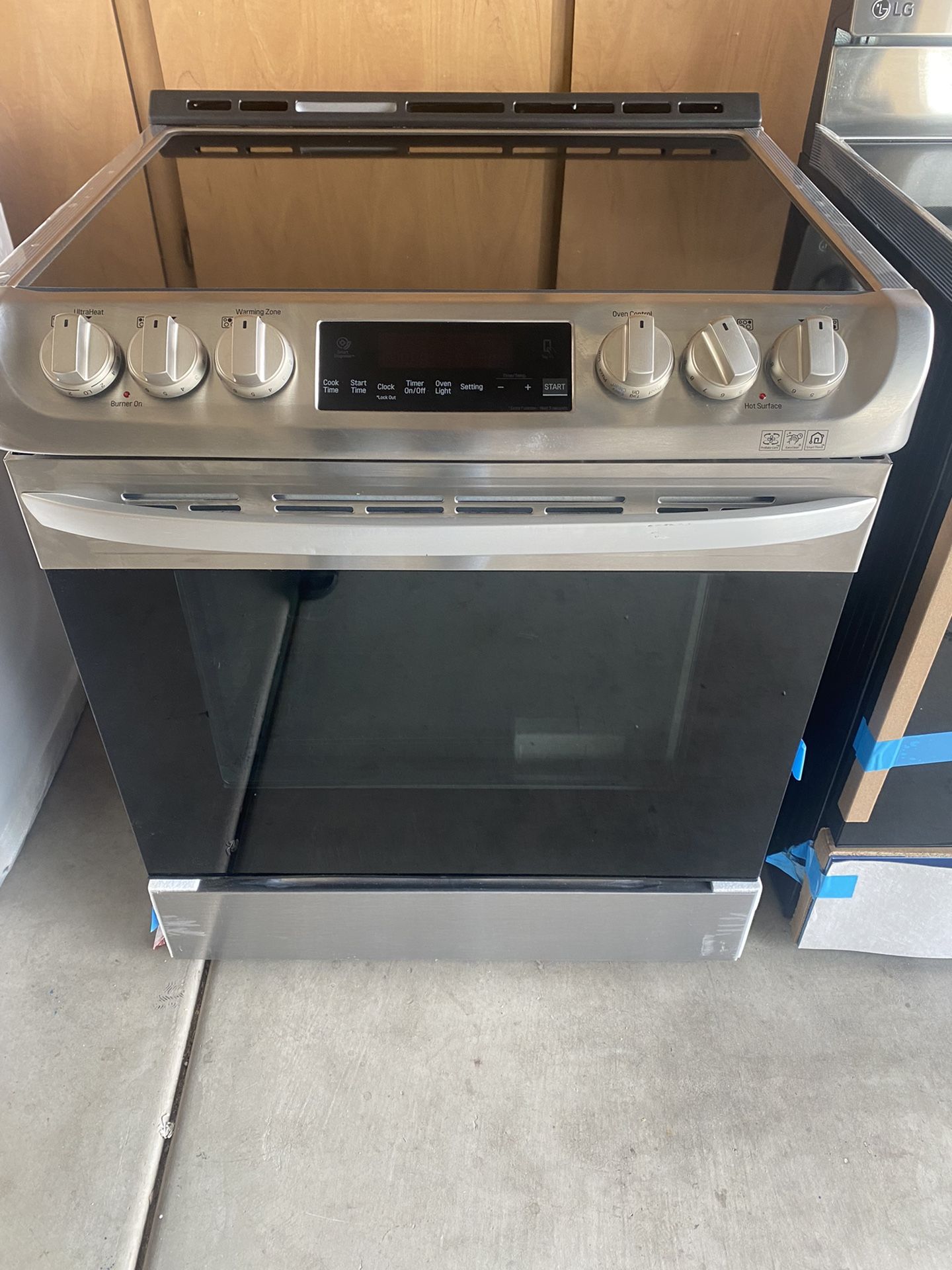 New open box slide in electric stove