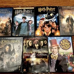 Lot of 7 DVDs including 2 Harry potter and pirates of the Caribbean. Some new 
