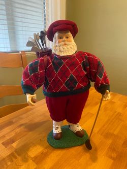 Vintage Golfing Santa with golf clubs. 15 x 9 inches. Good condition.