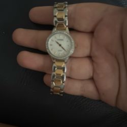Golden and diamond woman’s watch