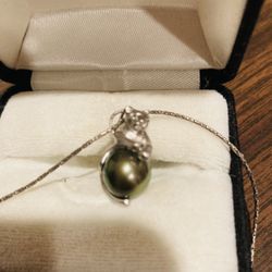 Cougar Cat Holding Pearl Pendant And Necklace