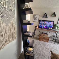 Black IKEA leaning book shelf