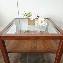 Wooden table with glass top