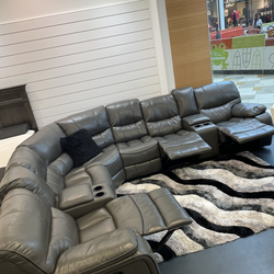 Winter clearance sale. Madrid gray leather reclining sectional only $1199. Easy finance option. Same-day delivery.
