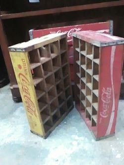 Coca-Cola bottle crates one yellow one red with 24 dividers