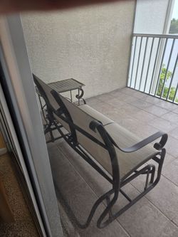 Lanai table 3 chairs and glider