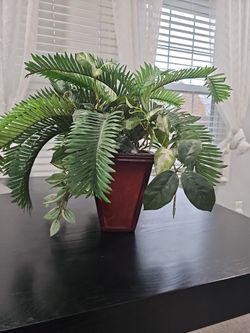 Jungle Themed Flower With A Wooden Vase