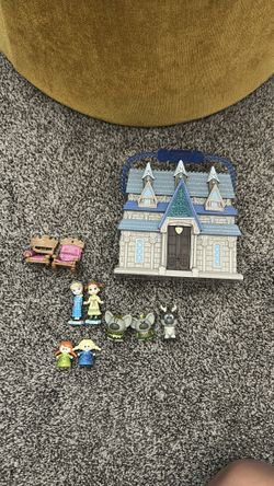 Frozen movie play set with a small doll house that opens.