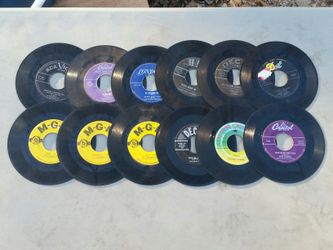 Dozen vintage 45 records from the 50s and 60s