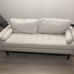 Cream 2 seater fabric loveseat; 2 throw pillows