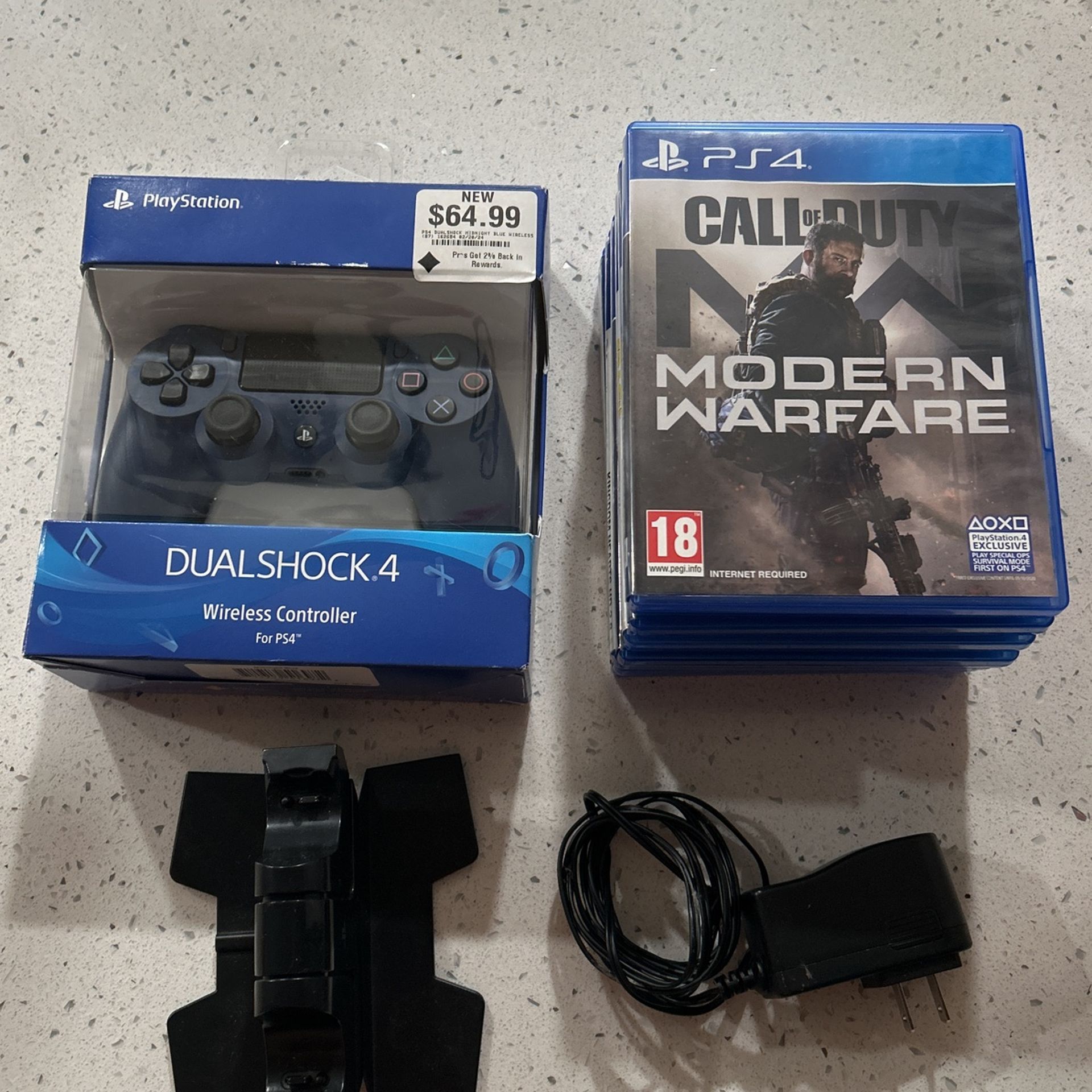 7 PS4 Games, PS4 Controller, And PS4 Charging Stand