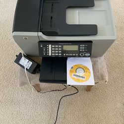 HP OfficeJet All-In-One Printer with power cord, cable and CD. Like new condition.