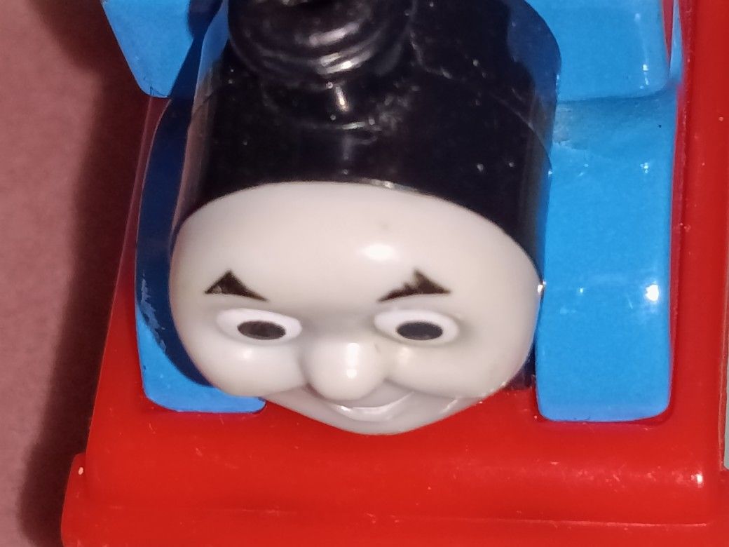 THOMAS TRAIN HAVE 12 TRAINS WITH THE NAMES AND ALSO ABOUT 50 PIECES OF TRACK ,$45