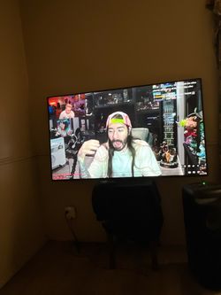 Large Flat Screen TV on Stand