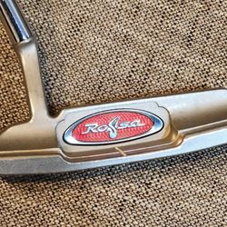 TAYLORMADE ROSSA INDY SPORT-6 BLADE PUTTER WITH TAYLORMADE PISTOL GRIP , PLAYS AT 33". INCREDIBLY STABLE AND GREAT FEEL AND ROLL OFF THE FACE.