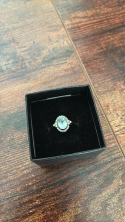 White gold aquamarine ring with diamond Halo