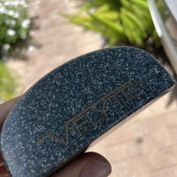 VFLYTE.   rare golf putter in right hand 