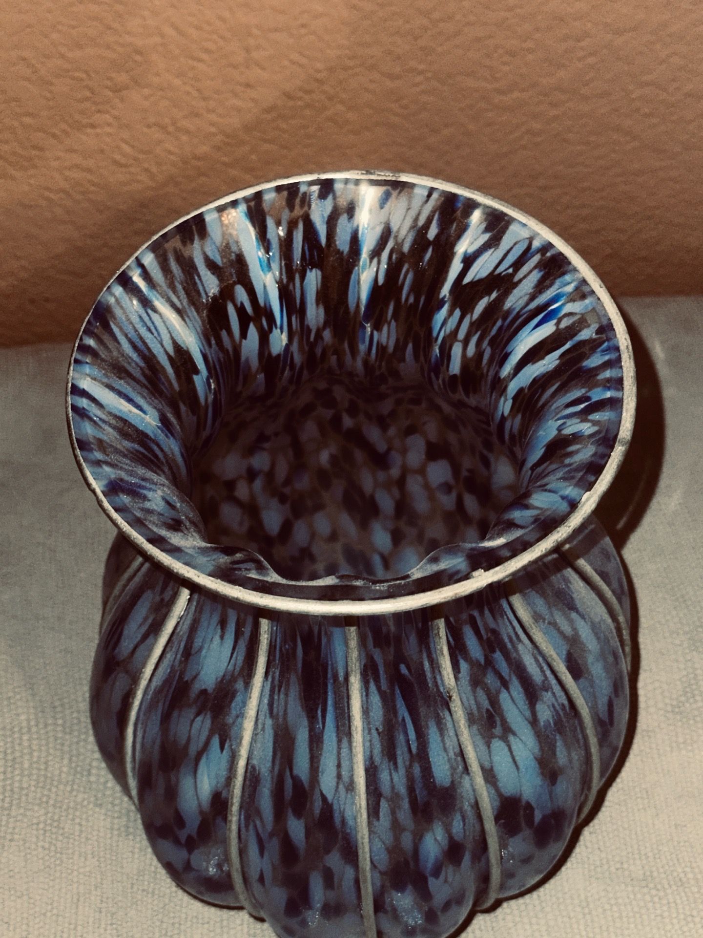 Unique glass vase with metal frame