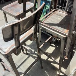  2 Metal  Seats With Backstands Stools.  Sold 2 Have 2 Left